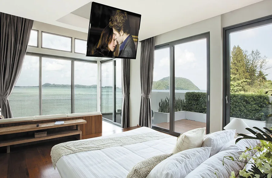 Ceiling Mounted TV In A Bedroom
